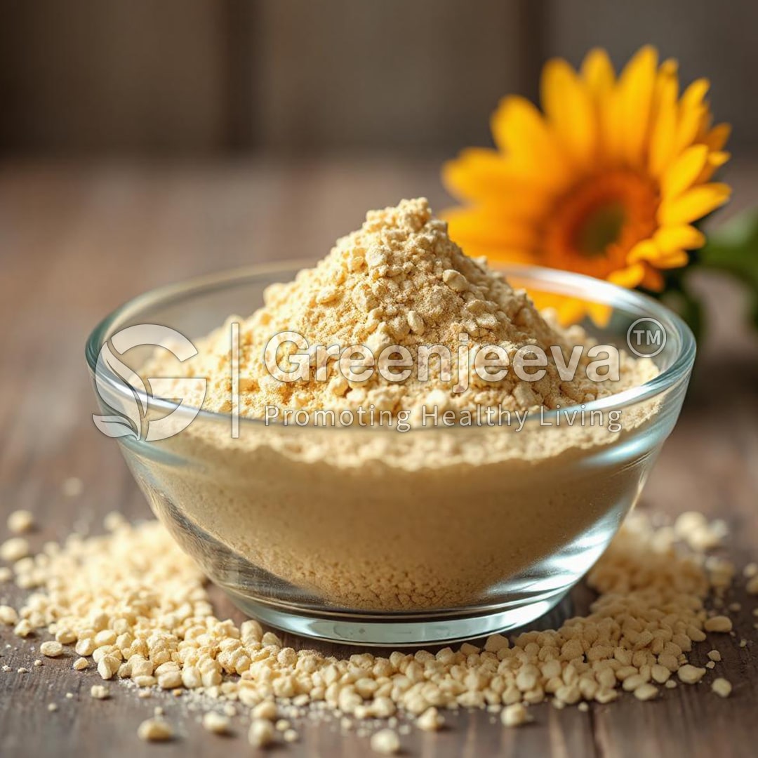 A glass bowl filled with sunflower lecithin powder sits on a wooden surface, surrounded by scattered seeds and a vibrant sunflower.