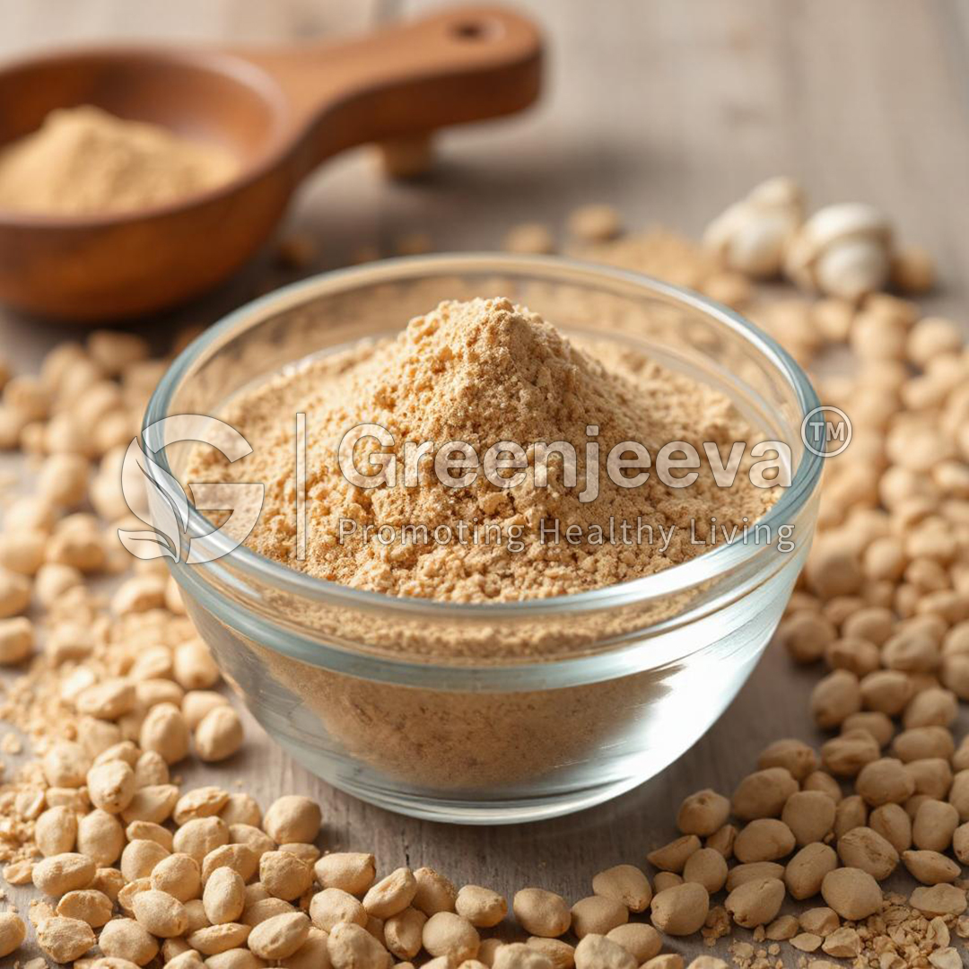 A glass bowl filled with Fenugreek Extract Powder 50% Saponins UV, surrounded by whole chickpeas and a wooden spoon with more flour.