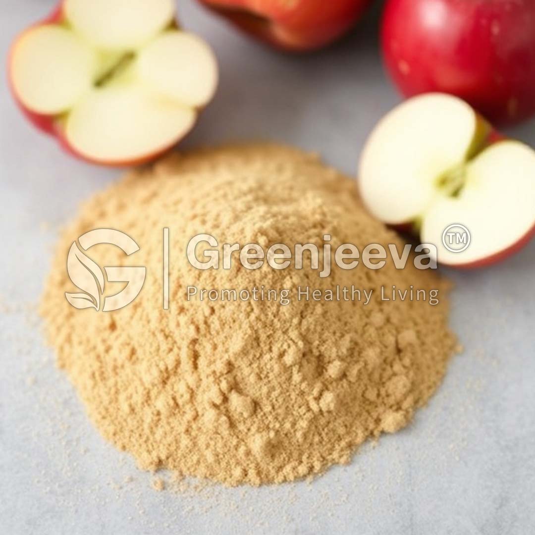 A pile of Organic Apple Cider Vinegar Powder in the foreground, with sliced red apples in the background, promoting healthy living.