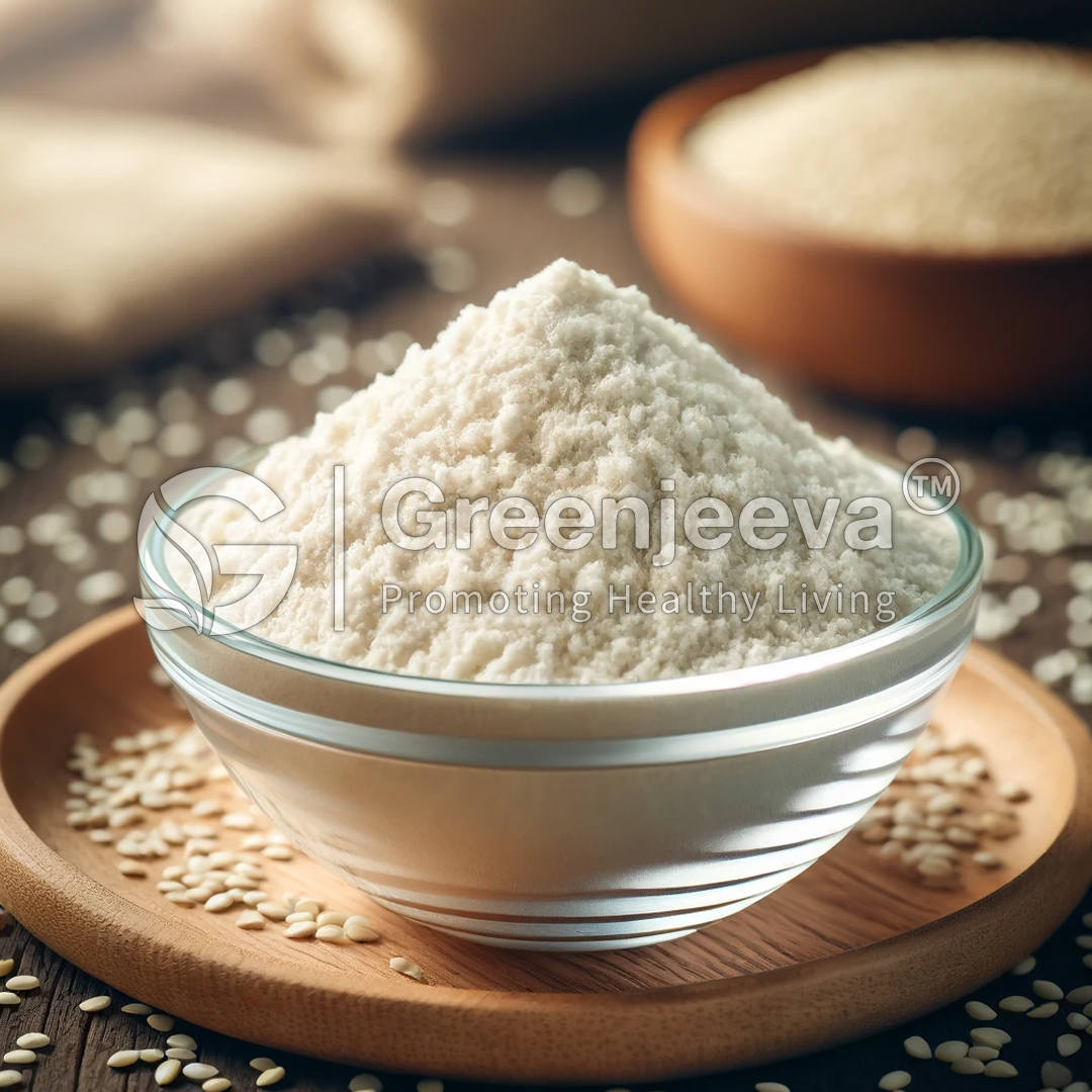 A glass bowl filled with Organic Sesame Seed Powder , surrounded by sesame seeds, on a wooden surface.