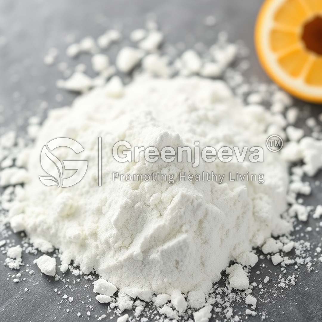 A pile of Vitamin D3 powder on a gray surface, with a sliced orange partially visible in the background.