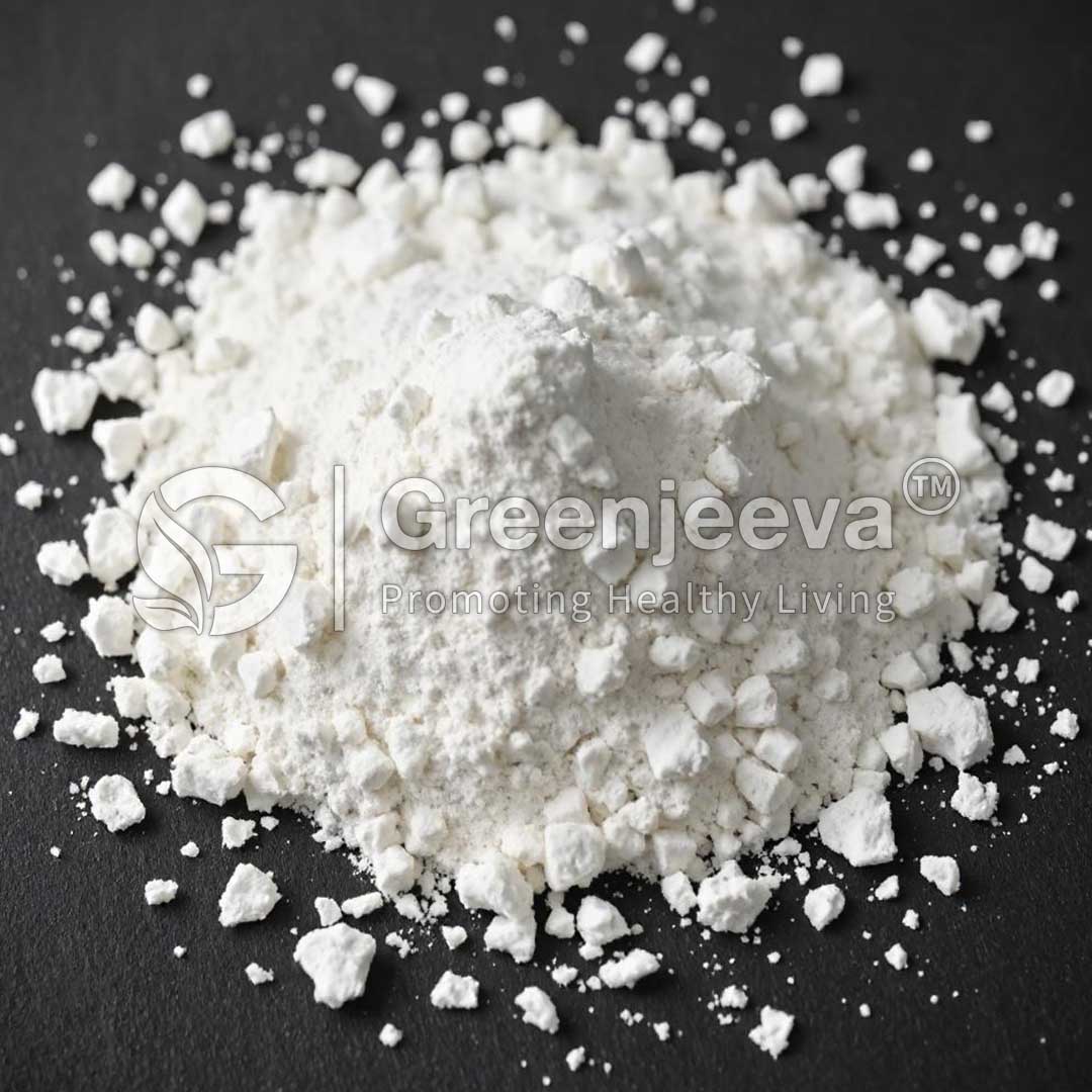 A mound of Sodium Beta Hydroxybutyarate Powder with scattered smaller fragments, set against a dark surface, featuring a logo for Greenjeeva.