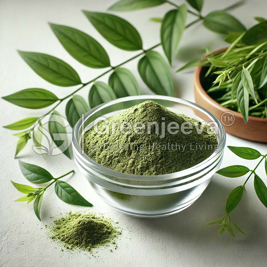 A bowl of green Organic Andrographis paniculata powder sits surrounded by vibrant green leaves, showcasing natural ingredients for healthy living.
