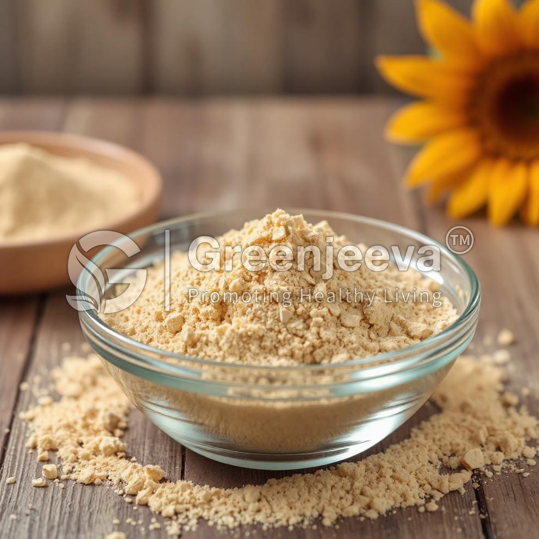 A glass bowl filled with Organic sunflower lecithin powder sits on a wooden surface, surrounded by scattered seeds and a vibrant sunflower.