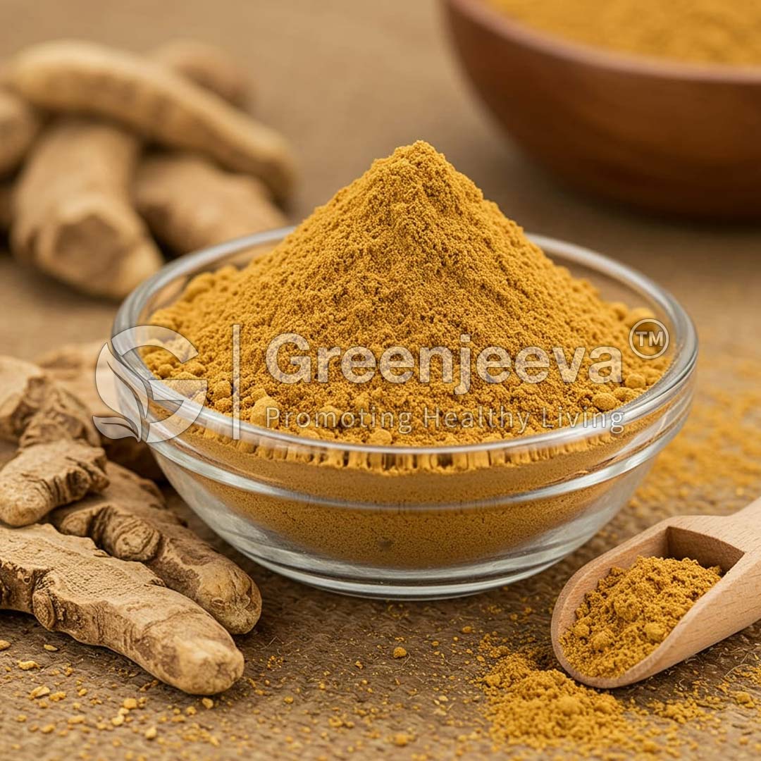 A bowl of vibrant Ashwagandha Root Extract Powder 5% Withanolides, HPLC sits on a wooden table, surrounded by fresh turmeric roots and a wooden scoop.