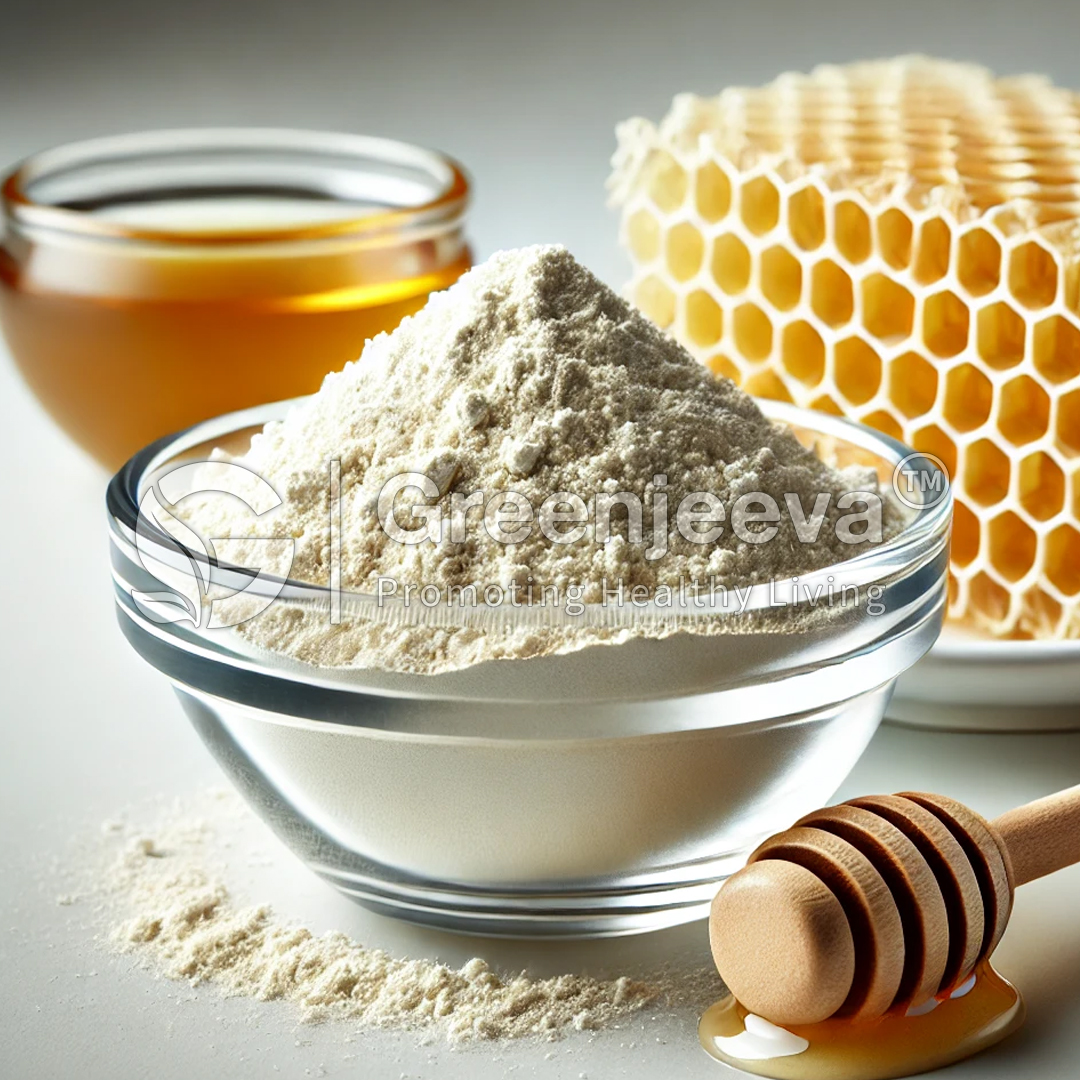 A bowl of Honey Powder sits beside honey in a glass jar, a honeycomb, and a wooden honey dipper, showcasing natural ingredients.