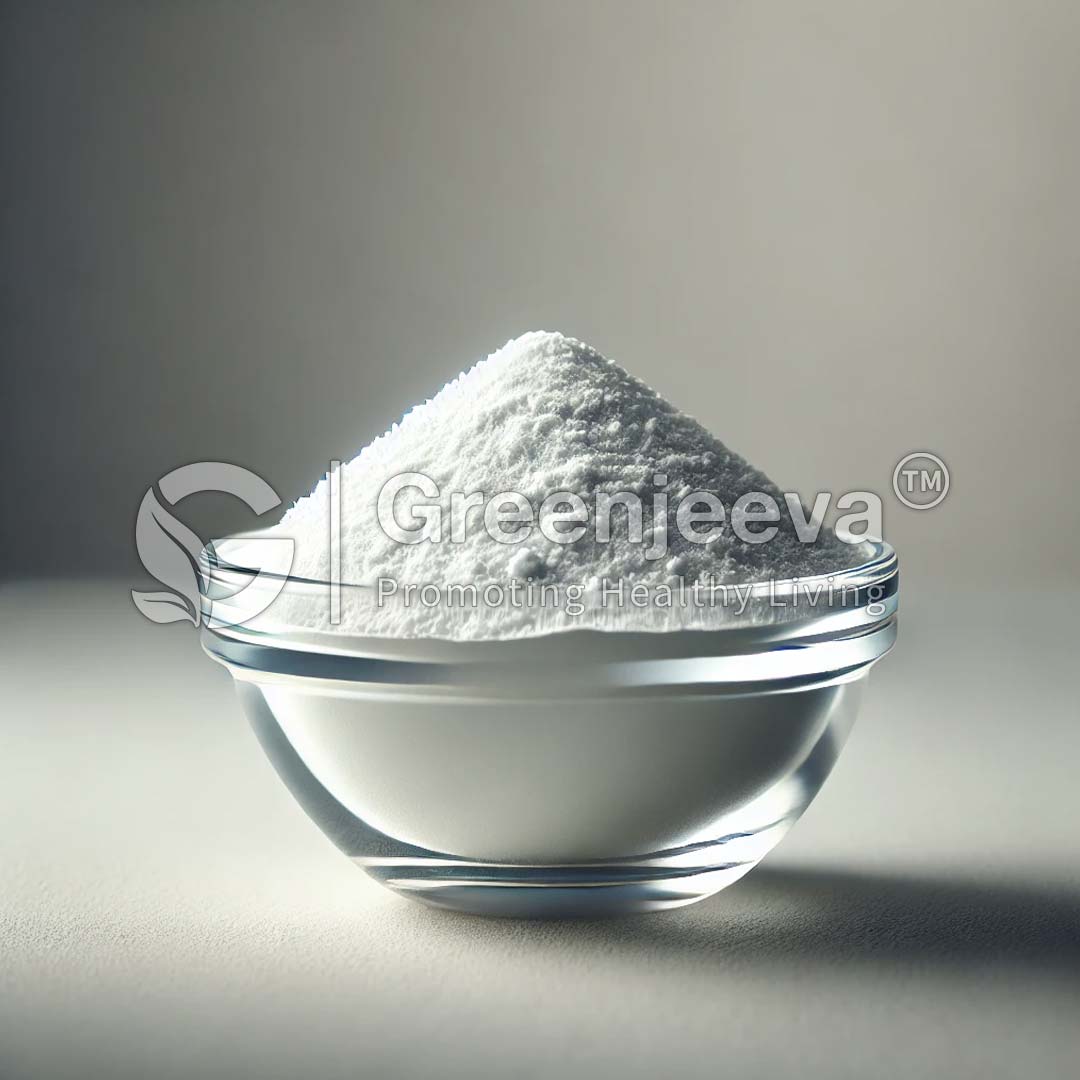 A clear glass bowl filled with a mound of white powder, softly illuminated against a neutral background.