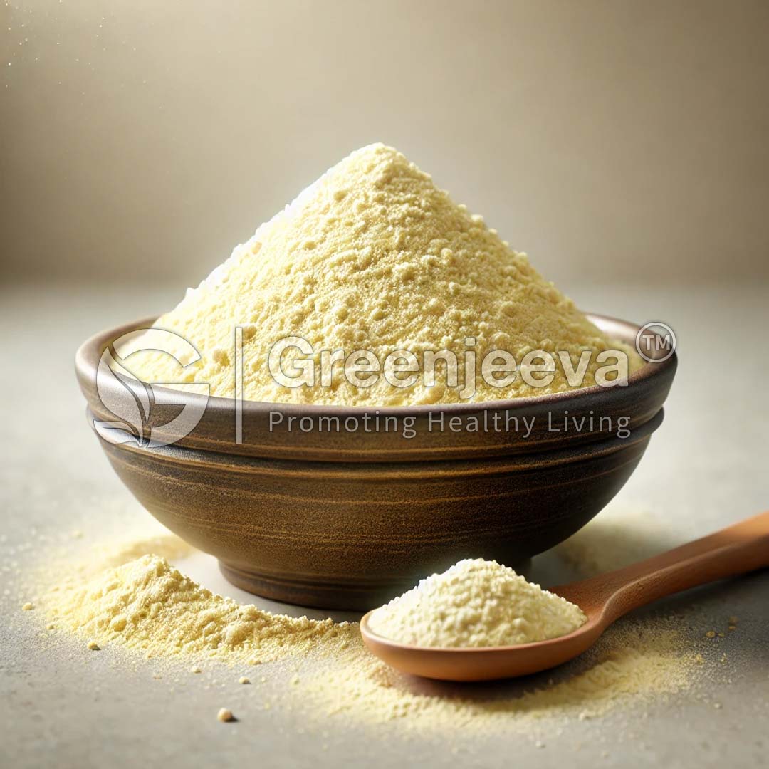 yellow powder sits on a surface, alongside a wooden spoon with a small amount of powder.