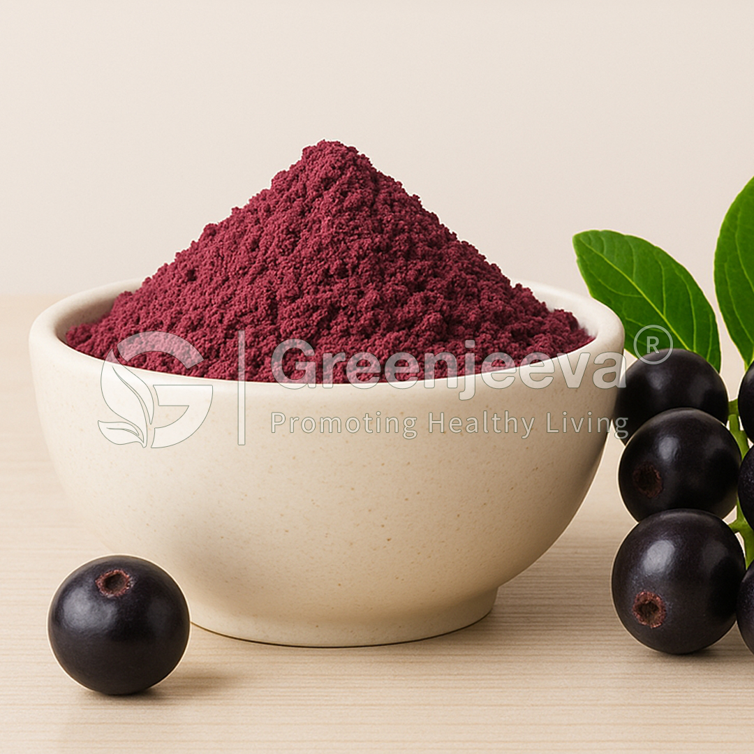 A bowl of Maqui Extract Powder next to fresh blackcurrants and green leaves, highlighting natural ingredients for healthy living.