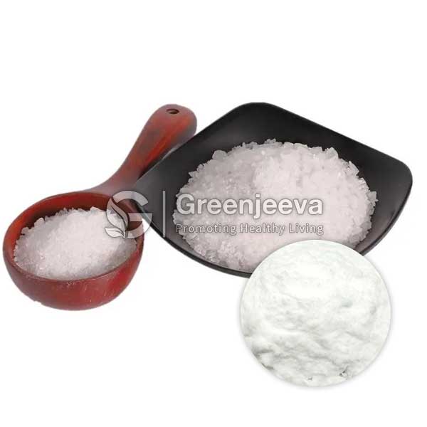 A wooden scoop and a black shovel filled with Melatonin Powder, alongside a close-up of fine salt on a white background.