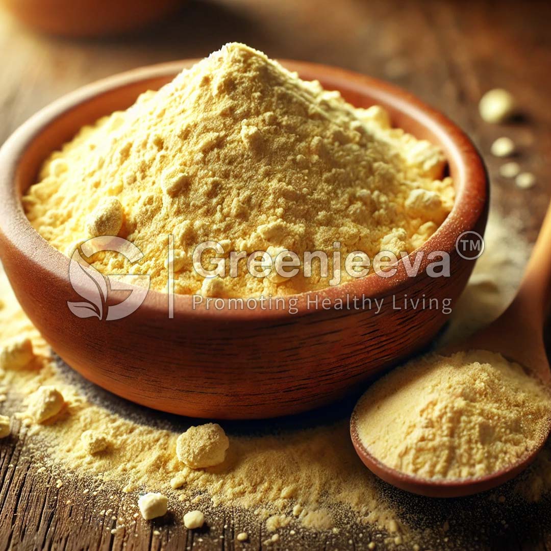 A rustic wooden bowl sits on a weathered wooden surface, filled with a Nutritional Yeast Powder that sparkles in the soft lighting. A wooden spoon rests beside it, complementing the natural textures of the scene.