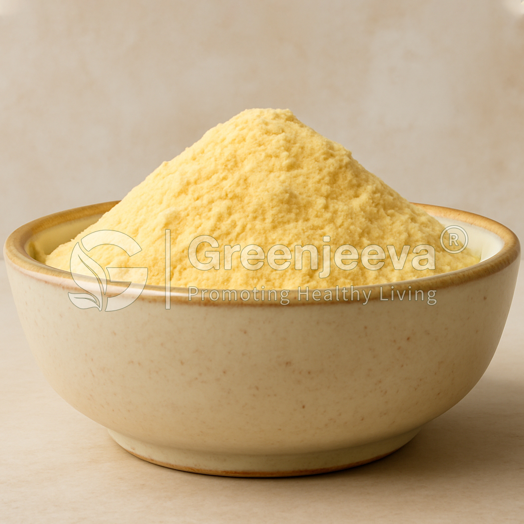 A bowl filled with Organic Acerola-Cherry Extract Powder32 Vitamin C sits against a neutral background, showcasing its fine texture and color. Greenjeeva branding visible.