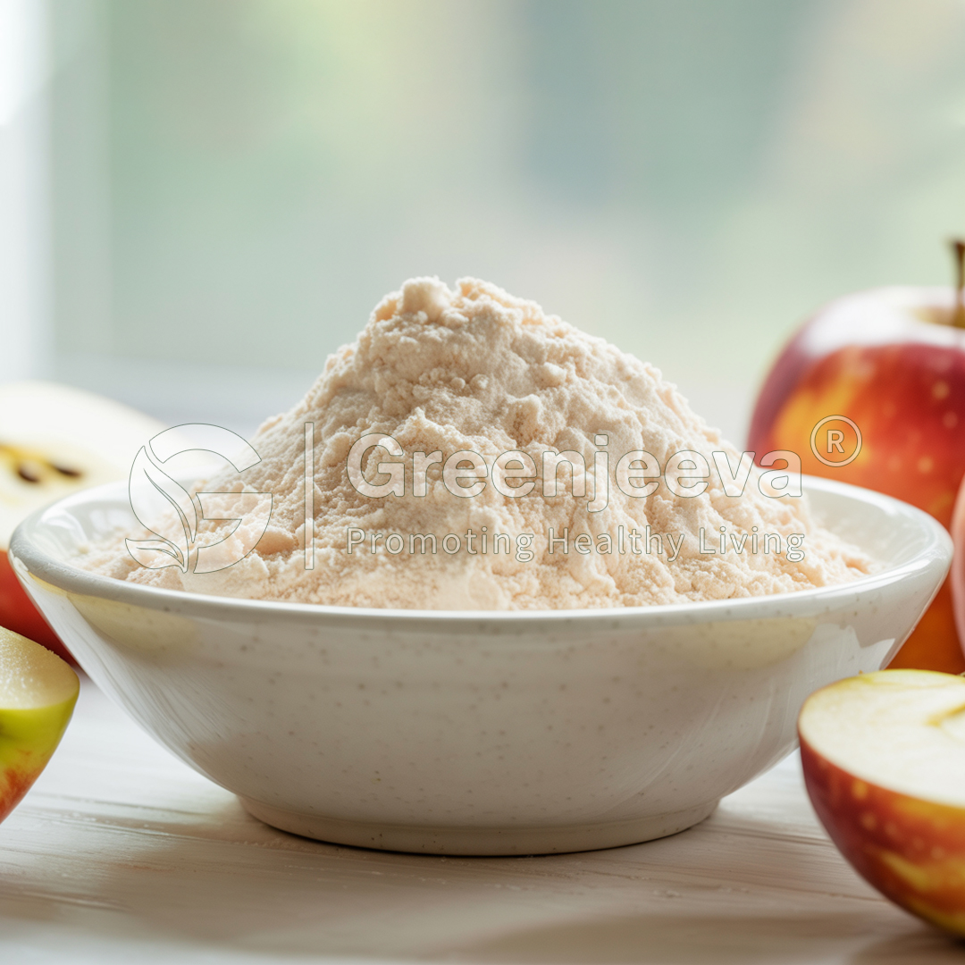 A bowl filled with fine, light-colored flour surrounded by fresh, vibrant apples on a wooden surface.