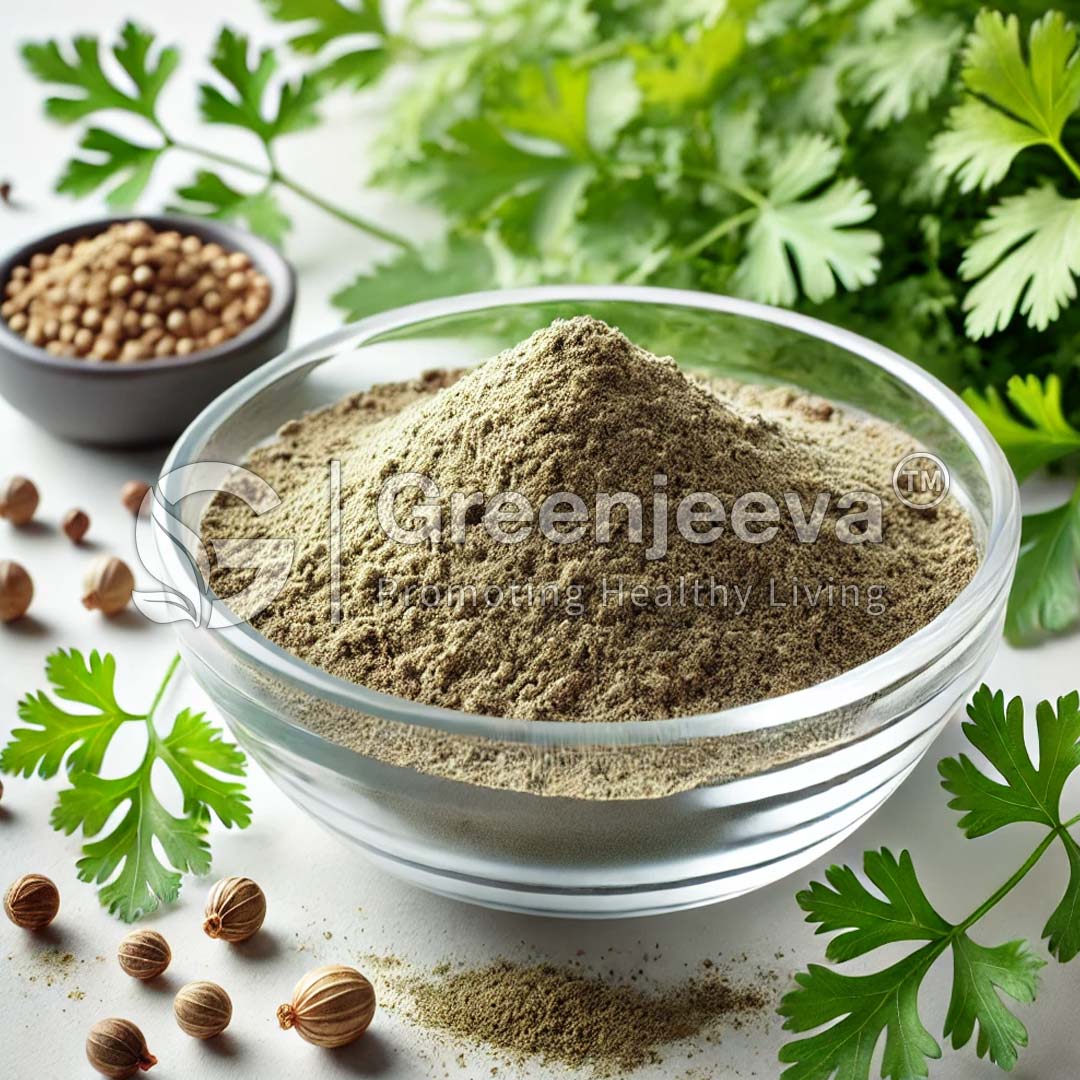 A bowl of Organic Coriander Powder surrounded by fresh coriander leaves and whole coriander seeds on a light surface.