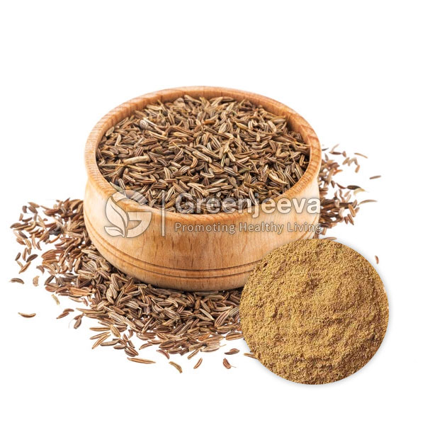 A wooden bowl filled with cumin seeds, surrounded by scattered seeds, with a small inset of ground cumin powder.