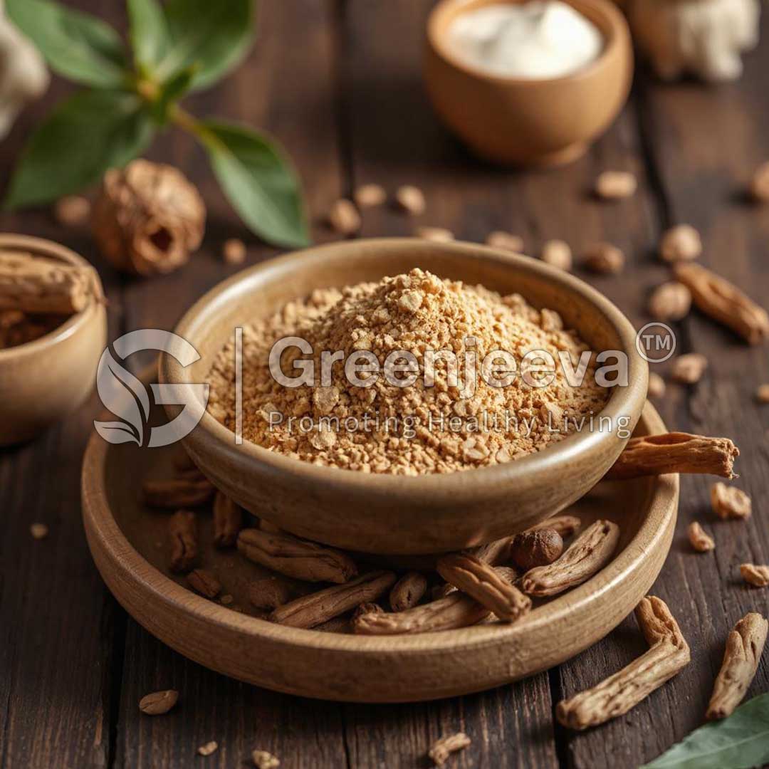 A bowl of Organic Haritaki Powder surrounded by roots and nuts, set on a wooden surface with leaves in the background.