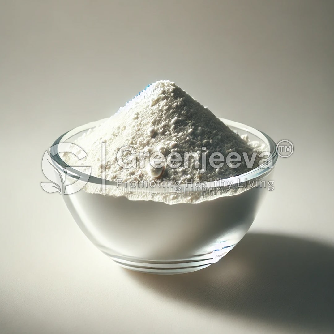 A glass bowl filled with fine white powder, illuminated softly against a neutral background, showcasing its smooth texture.