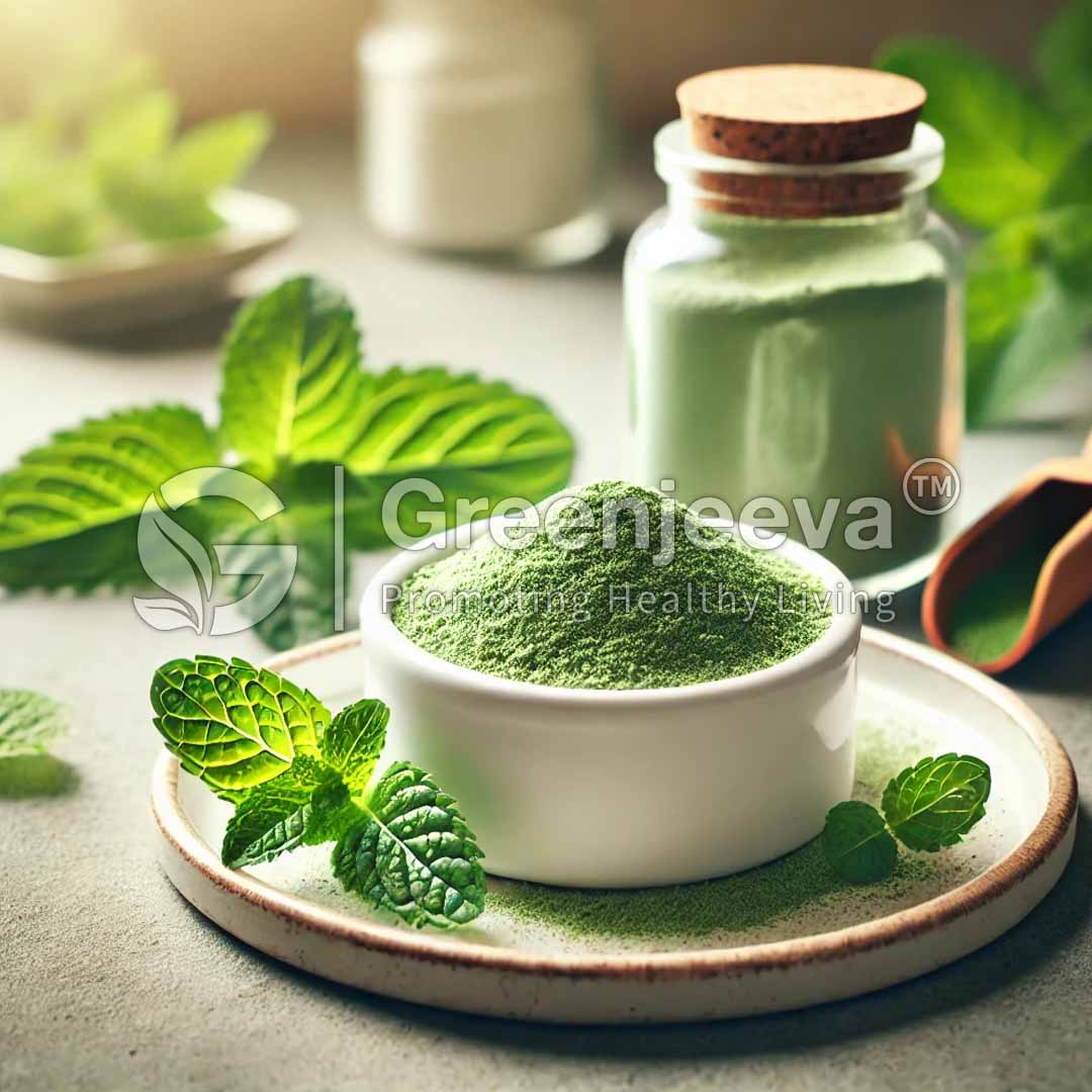 A bowl of Organic Spearmint Leaf Powder, surrounded by fresh mint leaves, with a glass jar of similar powder and a wooden scoop nearby.