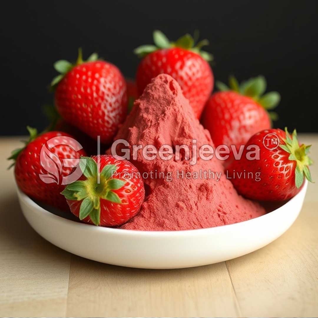A white bowl holds a mound of Organic Strawberry Juice Powder, surrounded by fresh, vibrant strawberries, against a dark background.