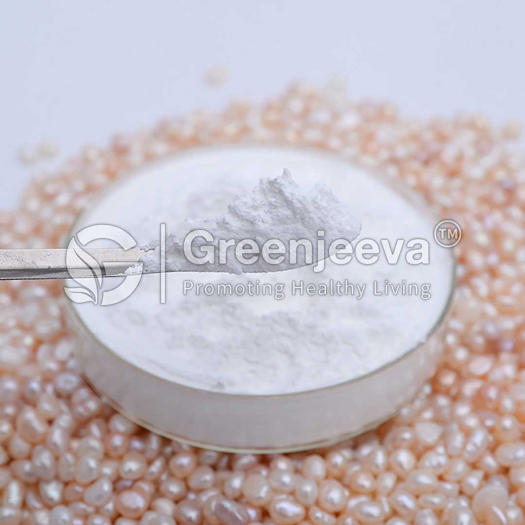 A silver spoon lifts Pearl Powder from a glass dish, surrounded by shimmering pearl-like beads, indicating a beauty or health product.