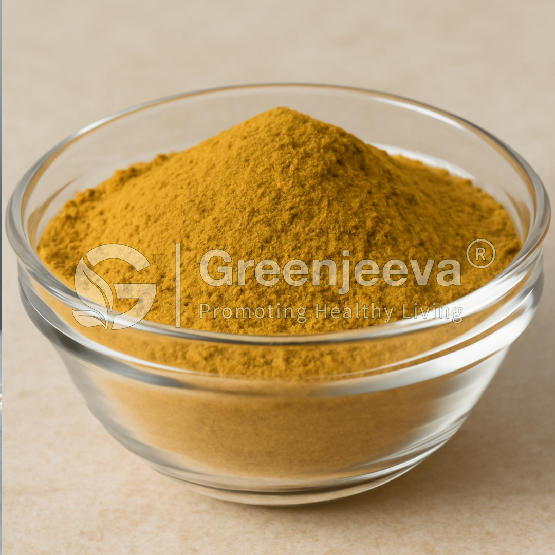 A bowl filled with golden-yellow powder, likely turmeric, sits on a light surface, promoting health and wellness.