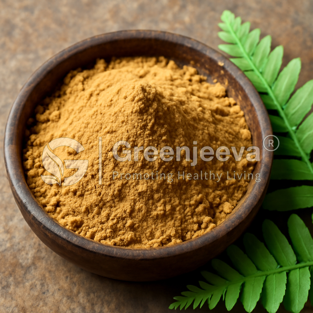 A wooden bowl filled with fine, vibrant Polypodium leucotomos Herb Extract powder, surrounded by green fern leaves on a textured surface.