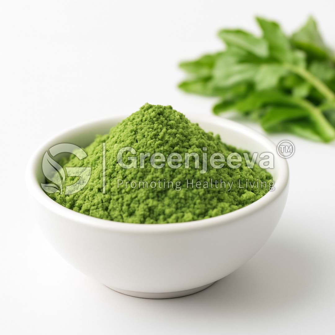 A white bowl filled with vibrant Spring Blend Powder sits on a table, accompanied by fresh green leaves in the background.