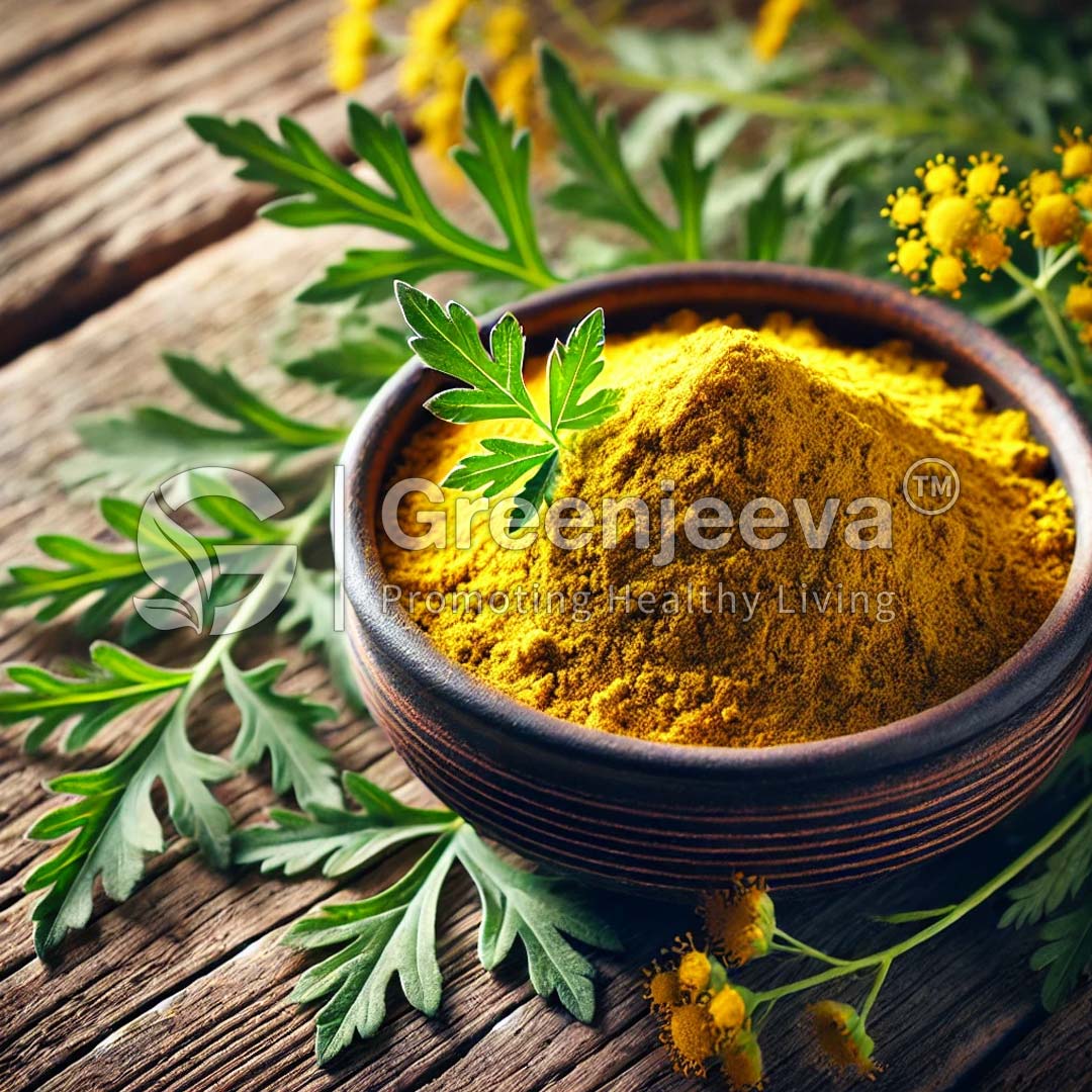 A wooden bowl filled with vibrant yellow spice powder, surrounded by fresh green leaves on a rustic wooden surface.