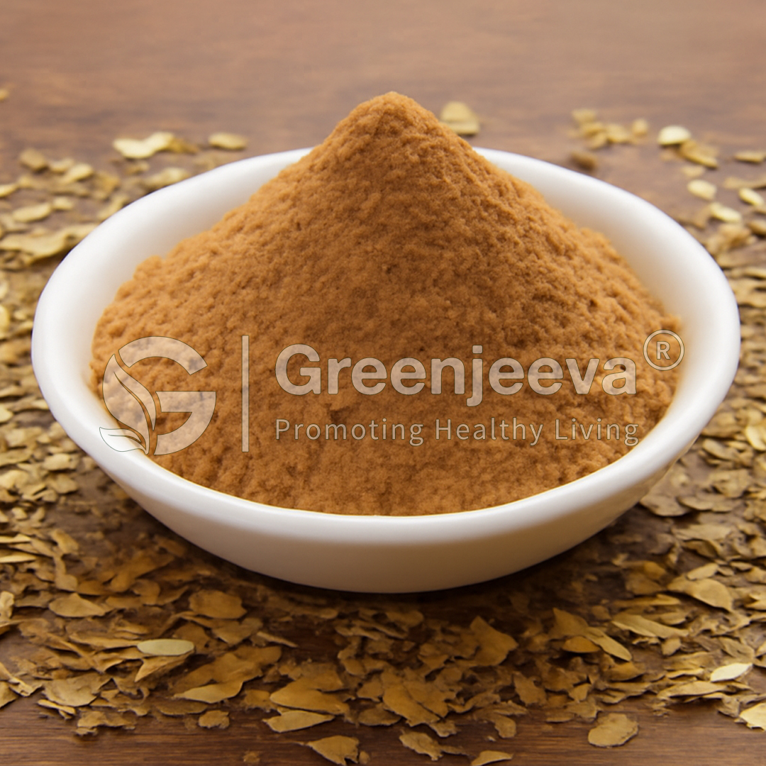 A bowl of yerba mate extarct powder surrounded by dried leaves, symbolizing natural health ingredients. Greenjeeva branding visible.