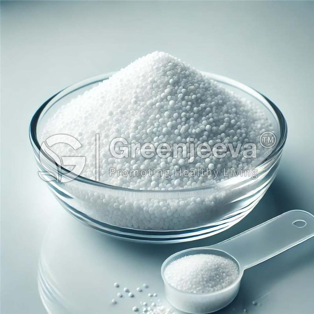 A clear glass bowl filled with calcium citrate granule, accompanied by a measuring scoop.