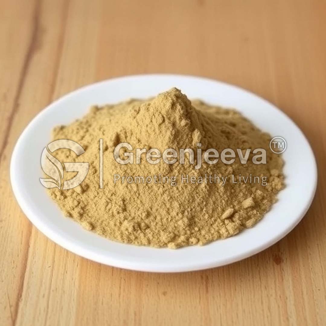 A mound of fine Maytenus ilicifolia Herb-Extract-Powder powder sits in a white plate on a wooden surface, labeled "Greenjeeva."