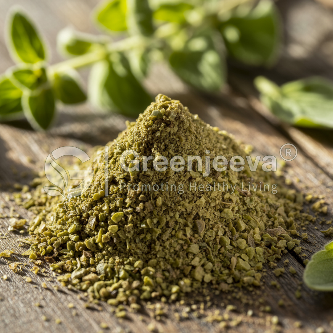 A close-up of a pile of dried oregano on a rustic wooden surface, with fresh oregano leaves in the background.