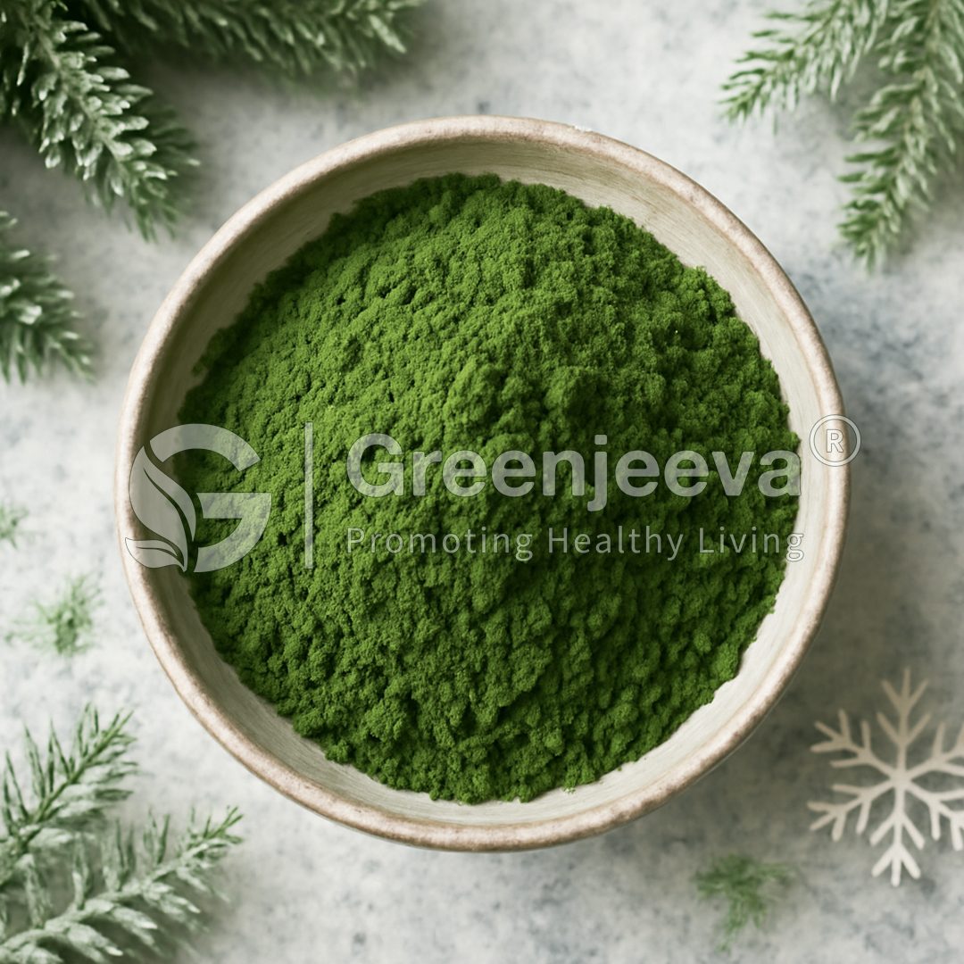 A close-up of vibrant Winter Blend powder in a bowl, surrounded by pine branches and a snowflake, emphasizing healthy living.